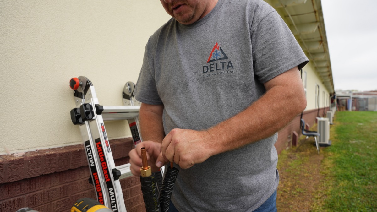 Delta Cooling technician performing AC repair in North Louisiana